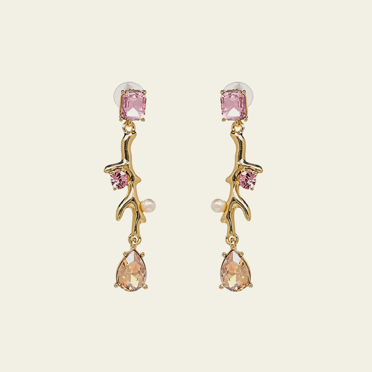 These elegant chandelier earrings feature a sleek, elongated design that cascades in a straight line, creating a graceful, linear look. The earrings are adorned with delicate light pink stones at the beginning, middle, and end of each pendant, adding subtle color and sophistication.